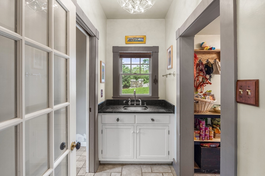 29 Dell Avenue Boston, MA 02136 - Photo 10 of 28 a kitchen with granite countertop a stove and a cabinets