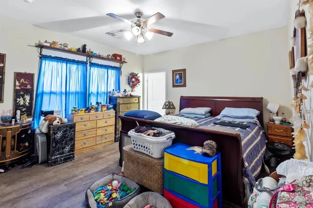a bed room with furniture and a chandelier