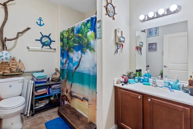 a bathroom with a sink a mirror and a shower