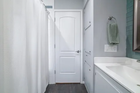 a bathroom with a sink and mirror
