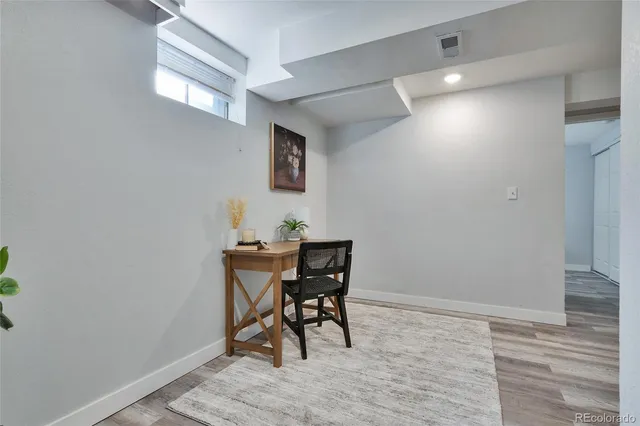 a workspace with furniture and wooden floor
