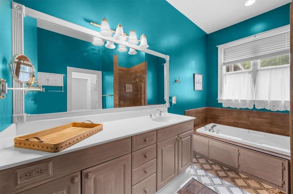 106 Westmore Road Southwest Rome, GA 30165 - Photo 43 of 56 a bathroom with a sink and a large mirror