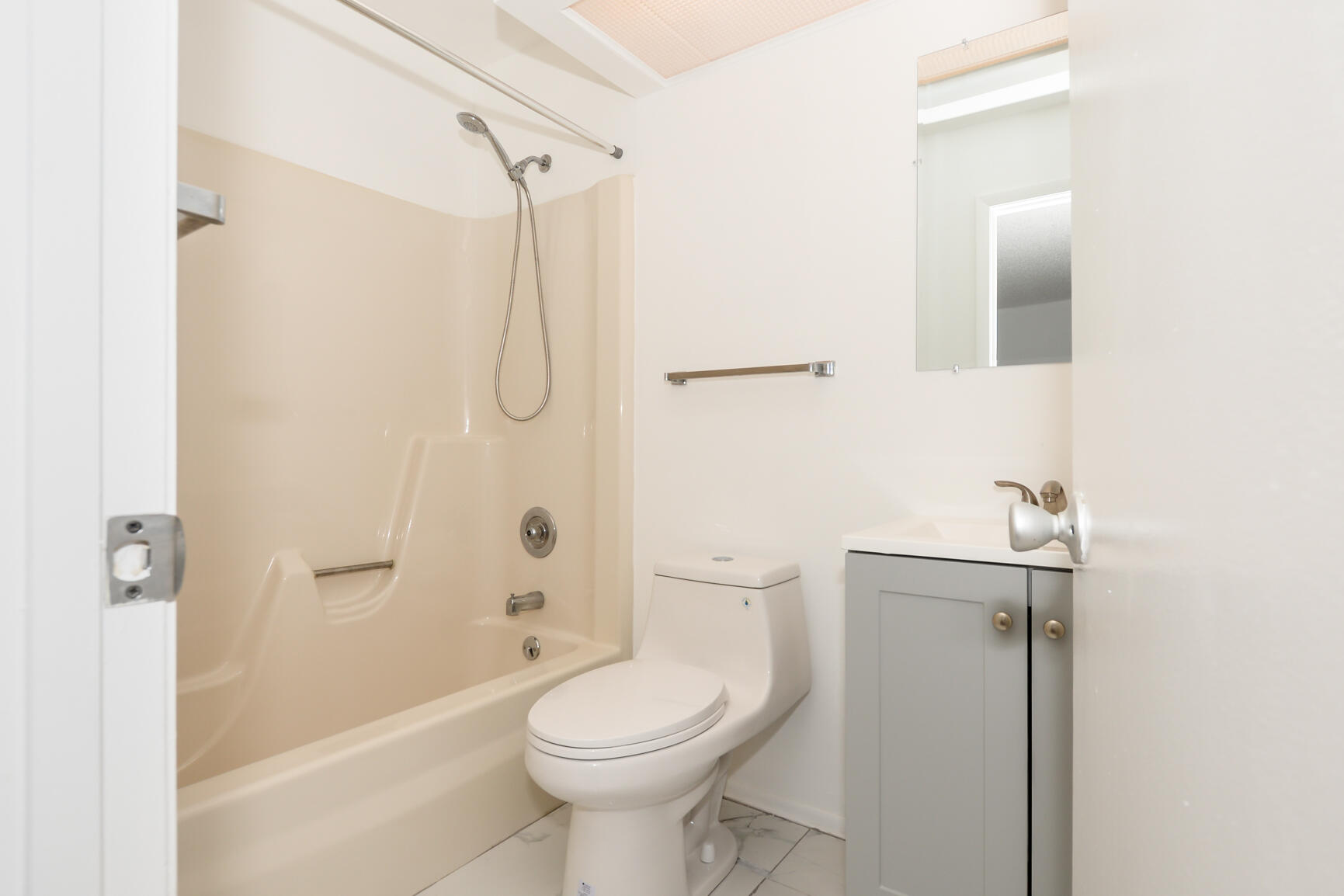 8 Lake Vista Trail, Unit 205 Port St. Lucie, FL 34952 - Photo 13 of 24 a bathroom with a granite countertop toilet sink and shower