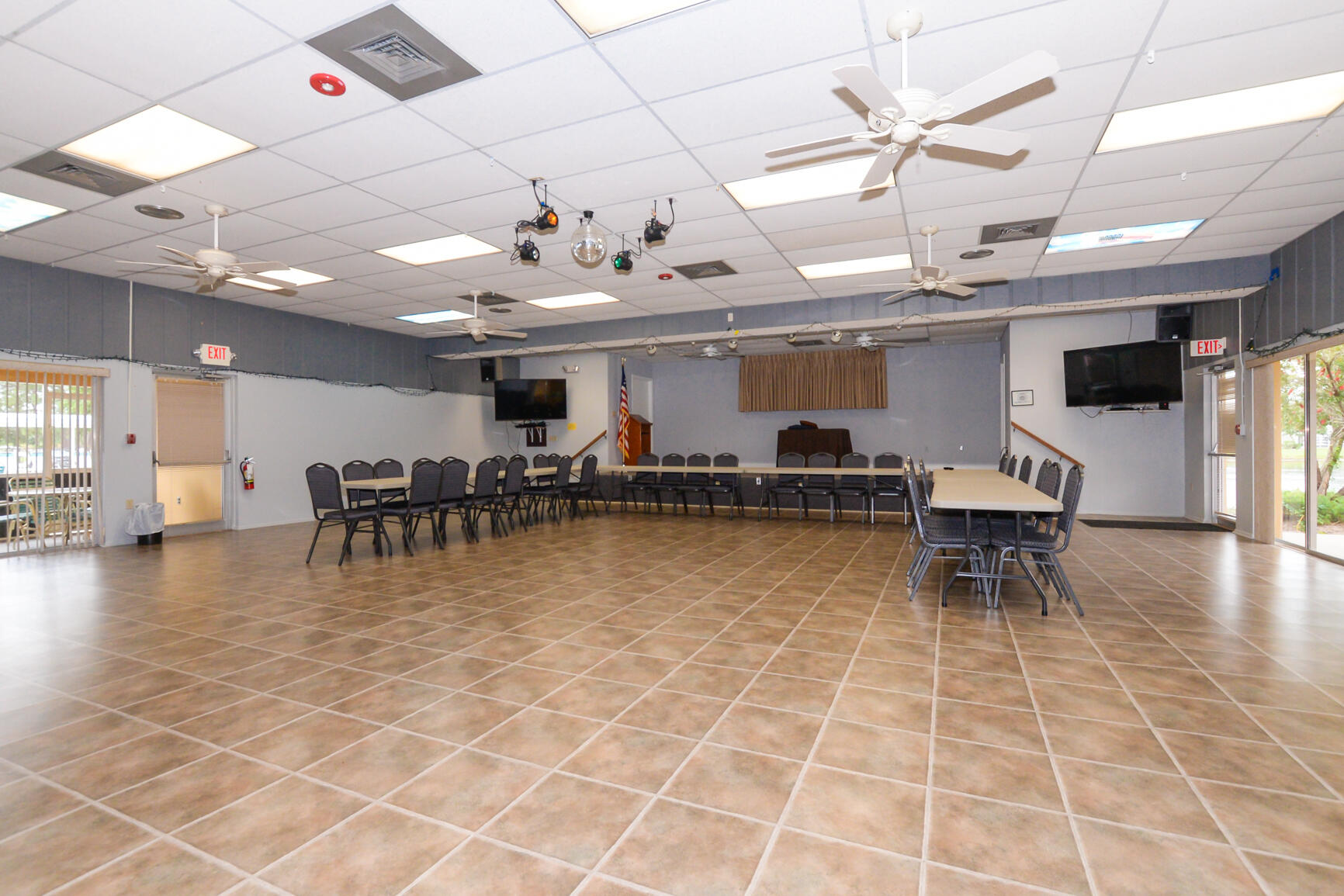 8 Lake Vista Trail, Unit 205 Port St. Lucie, FL 34952 - Photo 19 of 24 a view of a dining room with furniture and a chandelier
