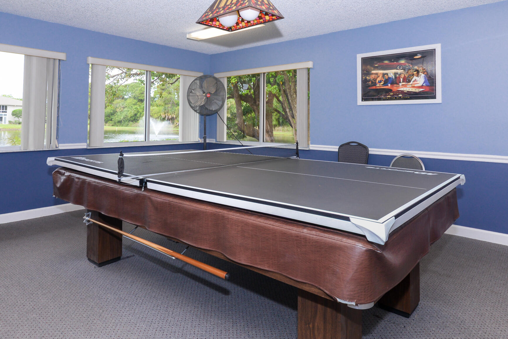 8 Lake Vista Trail, Unit 205 Port St. Lucie, FL 34952 - Photo 22 of 24 a bed sitting in a room with a large window