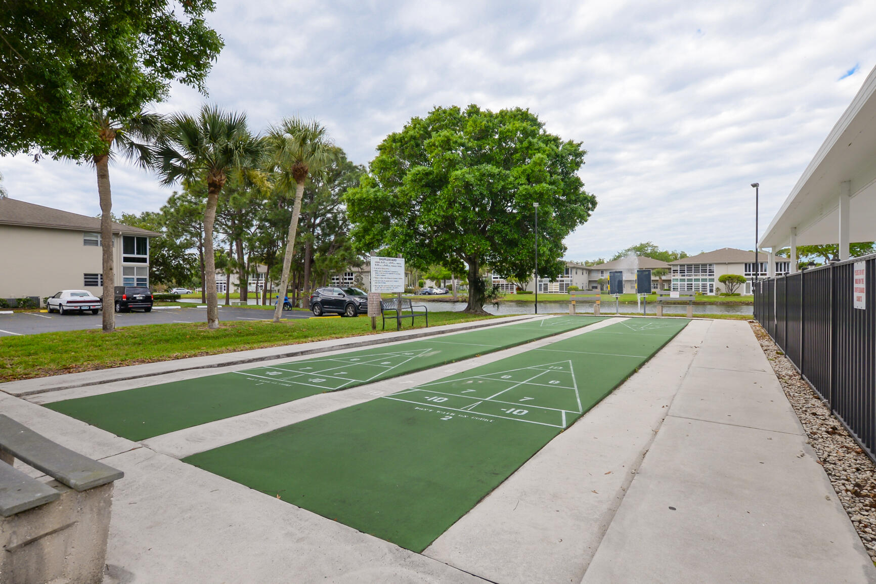 8 Lake Vista Trail, Unit 205 Port St. Lucie, FL 34952 - Photo 24 of 24 a view of a park with large trees