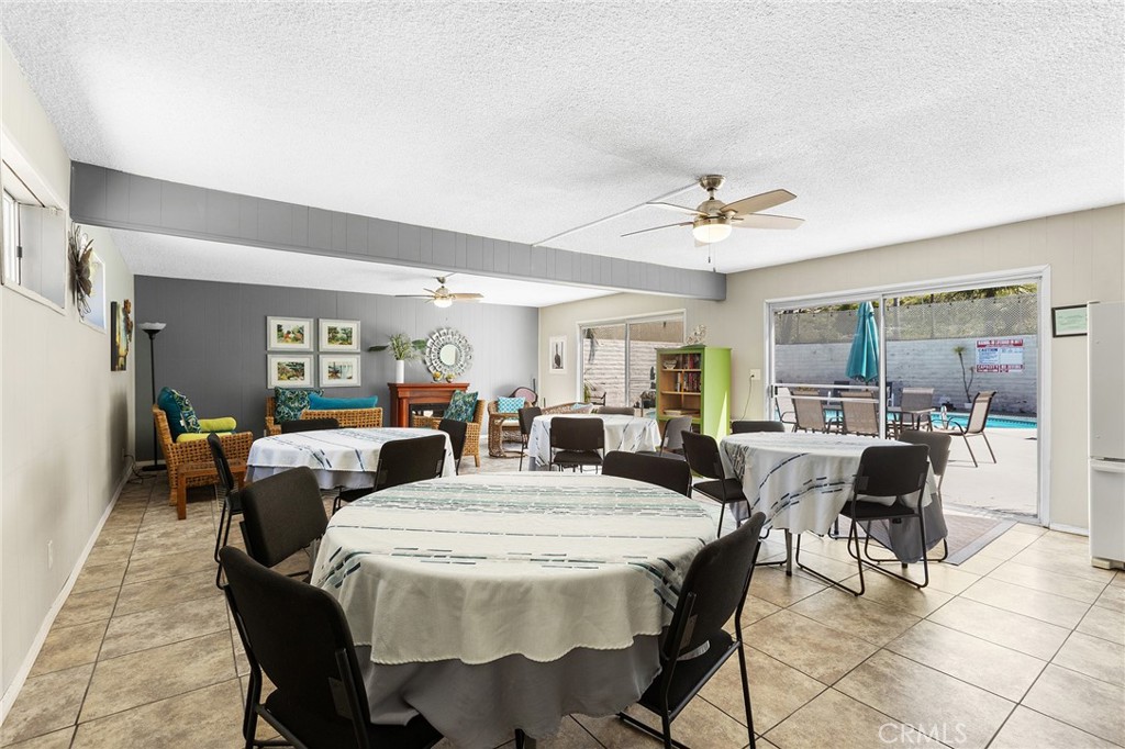 3606 Vista Rey, Unit 31 Oceanside, CA 92057 - Photo 35 of 50 Club house with eating area and look towards the pool area.