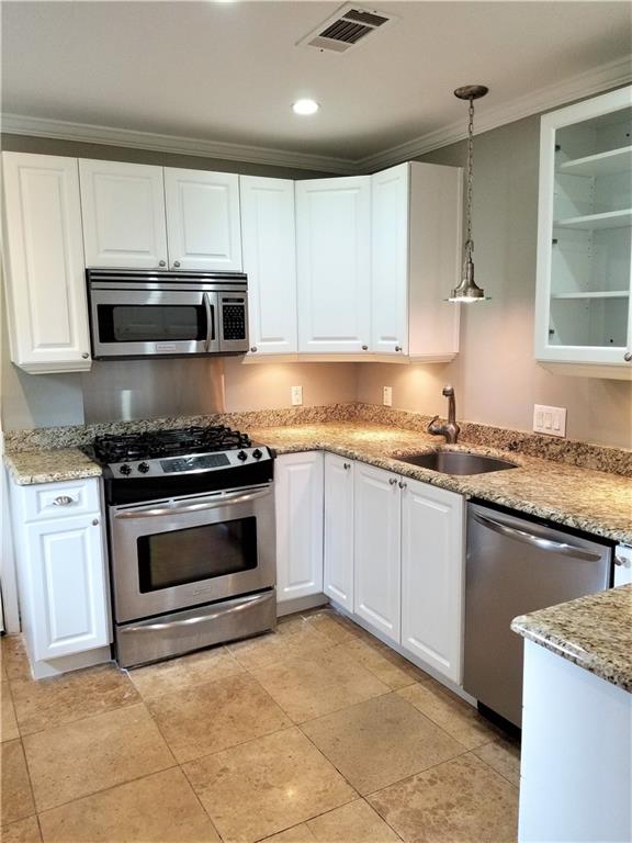 Reconfigured & Expanded Stainless/Granite Kitchen