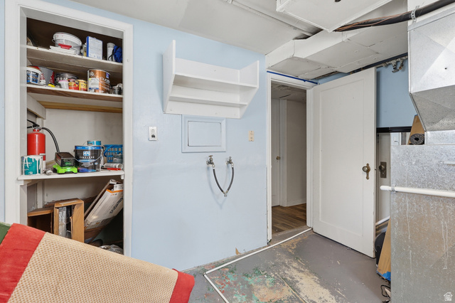 85 North 800 West Provo, UT 84601 - Photo 24 of 25 Utility area featuring open shelving, wall-mounted shelving unit, and plumbing hookups