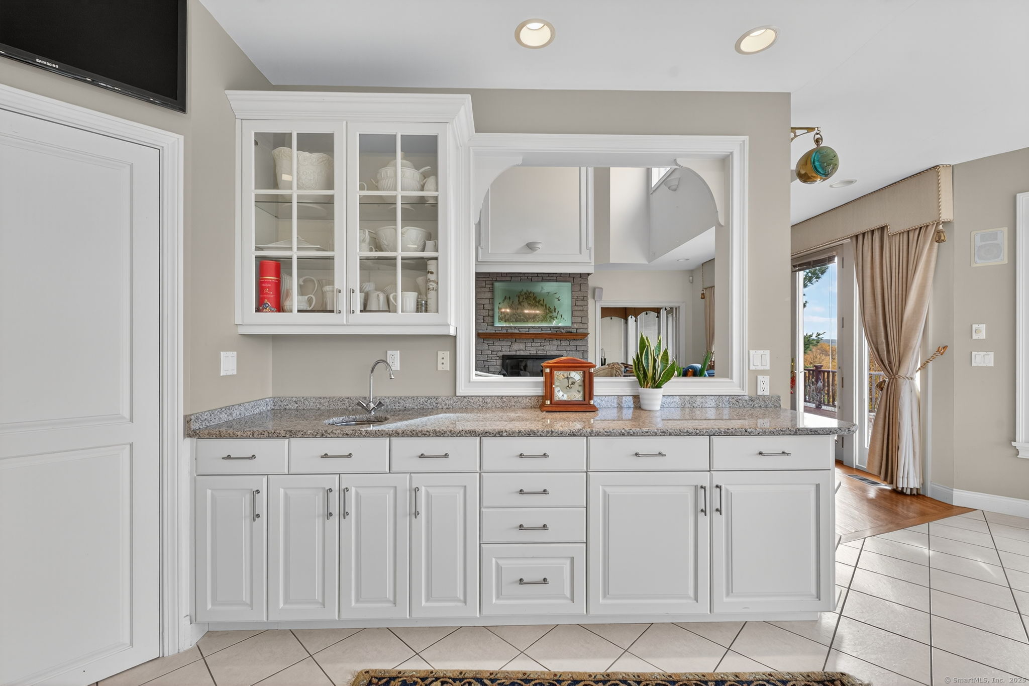 87 Colton Road Glastonbury, CT 06033 - Photo 11 of 39 a spacious bathroom with cabinets a sink a mirror and a shower