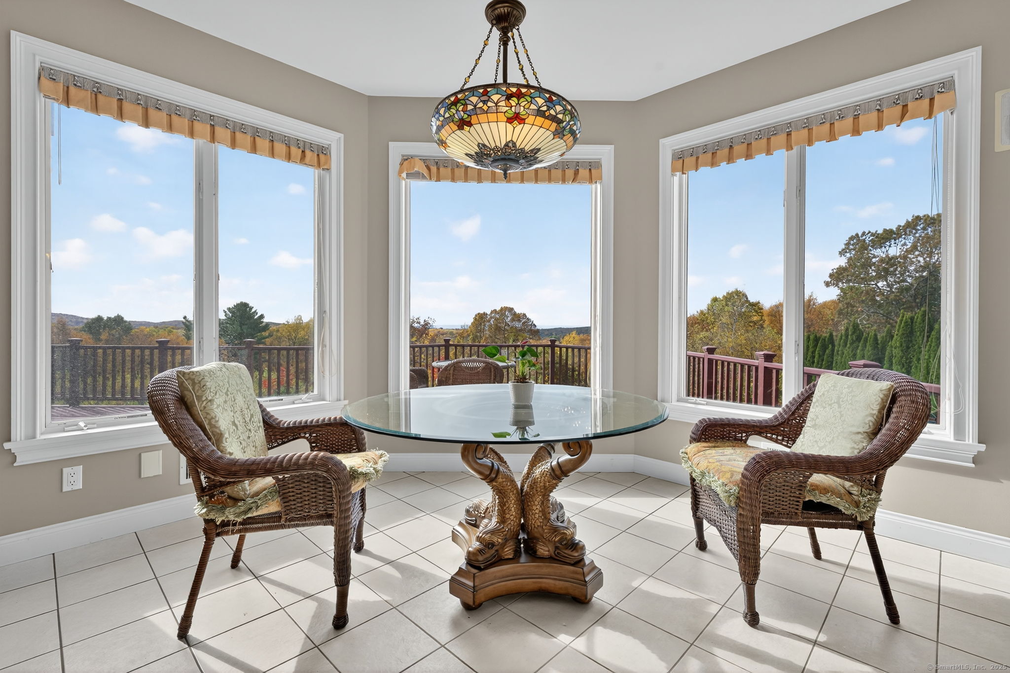 87 Colton Road Glastonbury, CT 06033 - Photo 12 of 39 a view of a living room with furniture and floor to ceiling window