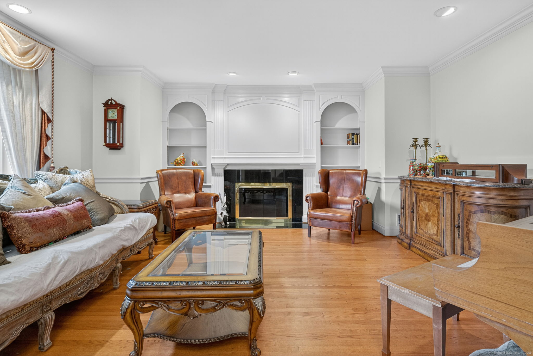 87 Colton Road Glastonbury, CT 06033 - Photo 13 of 39 a living room with furniture and a fireplace
