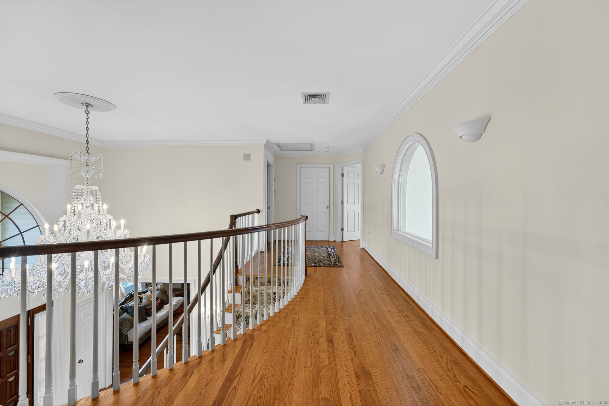 87 Colton Road Glastonbury, CT 06033 - Photo 27 of 39 a view of a hallway with wooden floor and stairs