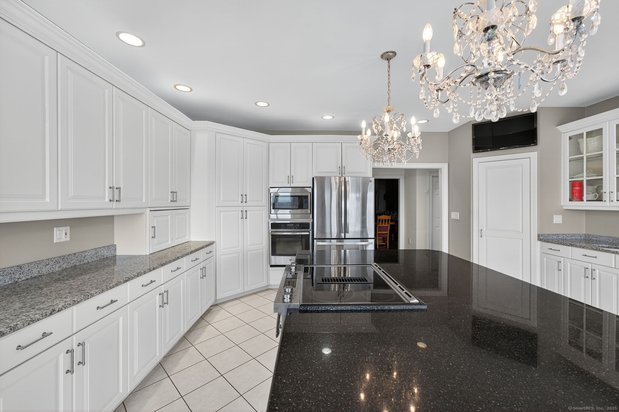 87 Colton Road Glastonbury, CT 06033 - Photo 9 of 39 a large kitchen with cabinets