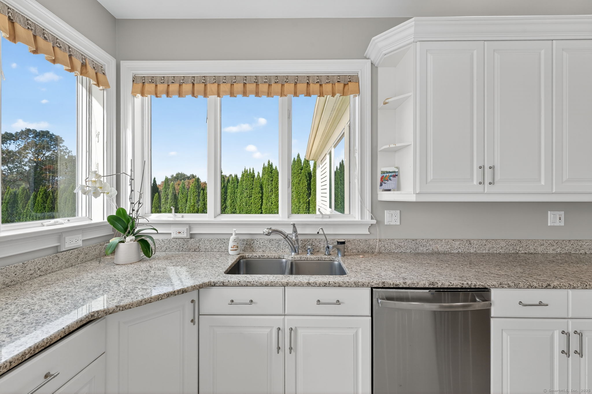 87 Colton Road Glastonbury, CT 06033 - Photo 10 of 39 a kitchen with granite countertop a sink and a white floor