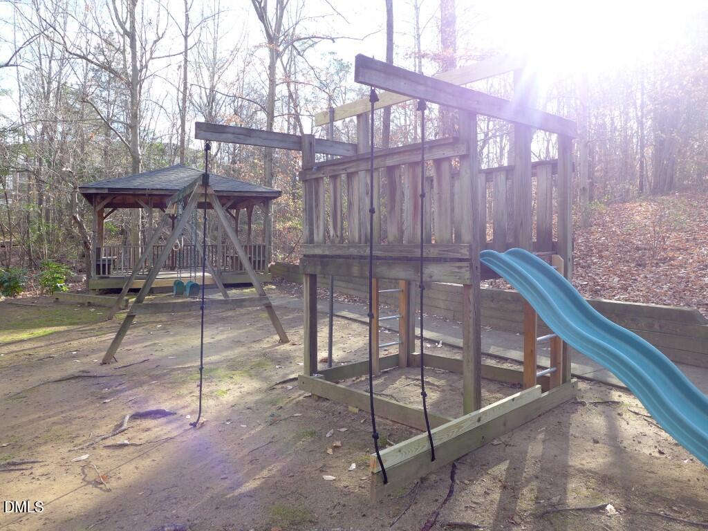 101 Rock Haven Road, Unit A100 Carrboro, NC 27510 - Photo 14 of 16 a view of a backyard with sitting area