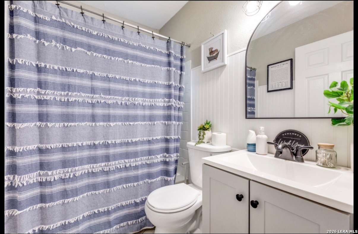 507 Stimmel Drive San Antonio, TX 78227 - Photo 6 of 7 a bathroom with a sink toilet and shower
