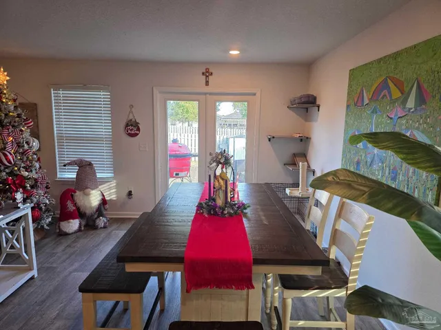 a kitchen with a refrigerator a stove and cabinets