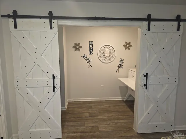 a bedroom with a bed a couch and dresser