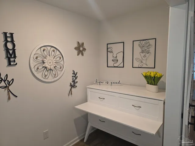 a bedroom with furniture and flat screen tv