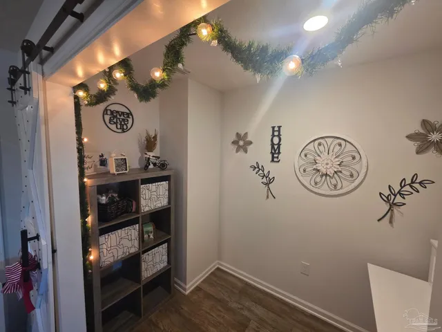 a en suite bathroom with a double vanity sink and a mirror