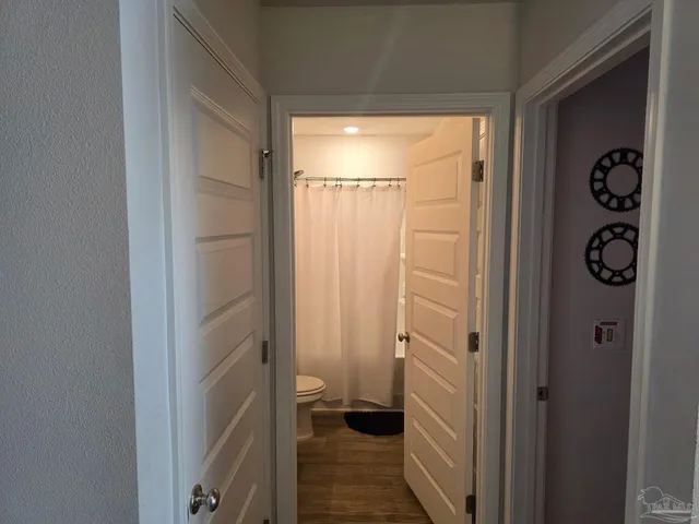 a bedroom with furniture and a potted plant