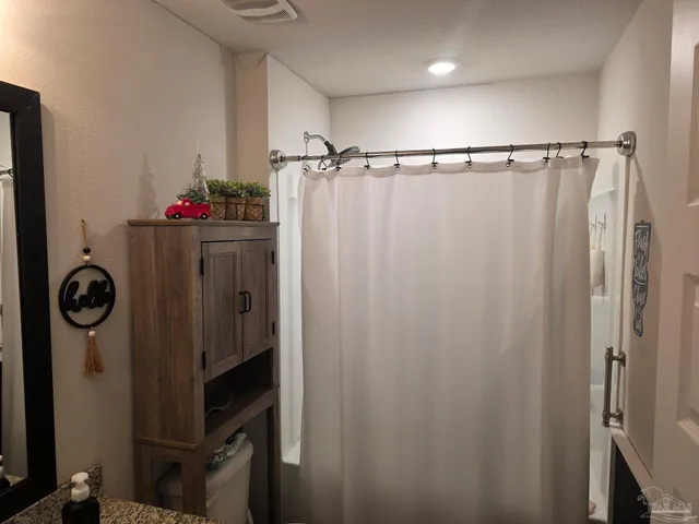 a front view of a house with table and chairs