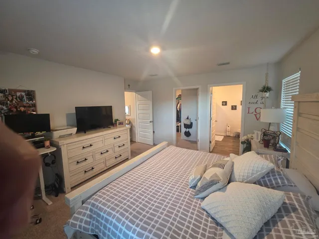 a view of backyard with wooden fence