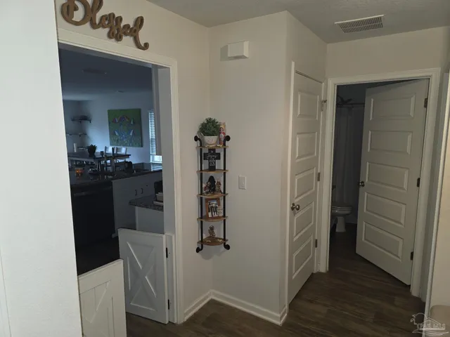 a kitchen with sink stove and refrigerator
