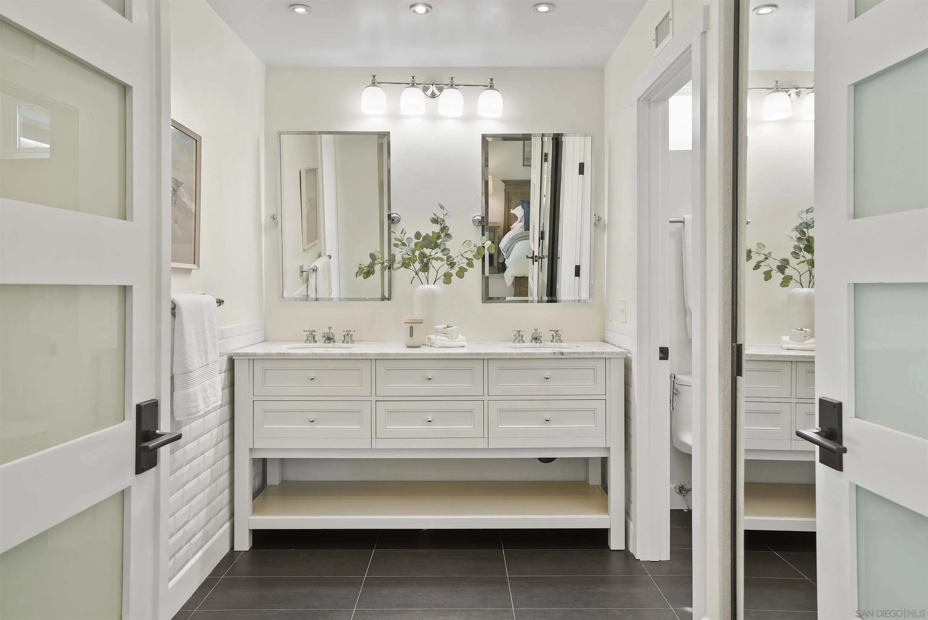 1328 Sun Valley Road Solana Beach, CA 92075 - Photo 15 of 24 a bathroom with a bathtub sink and mirror