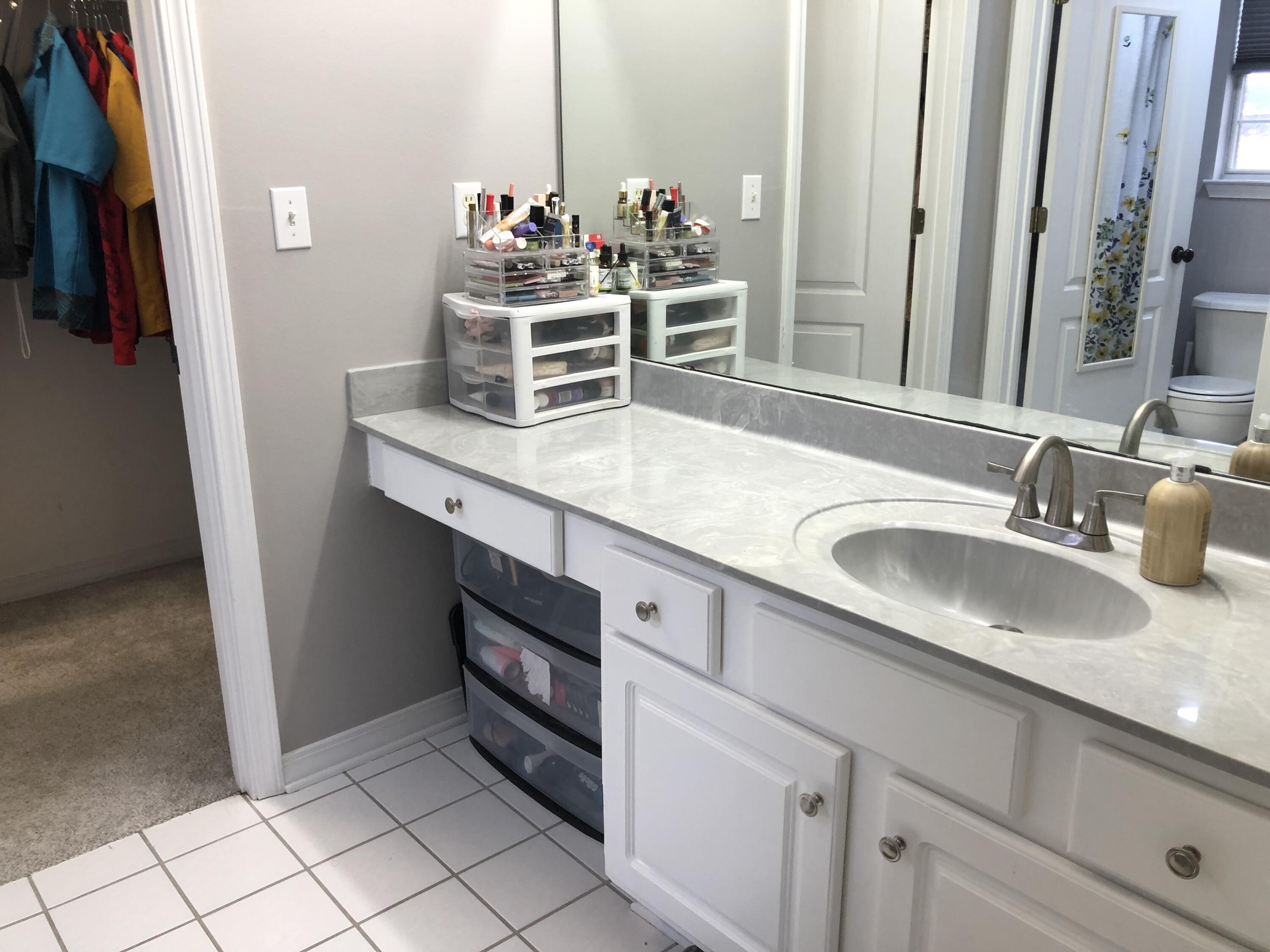 398 Riverchase Boulevard Crestview, FL 32536 - Photo 18 of 36 a bathroom with a sink and a mirror