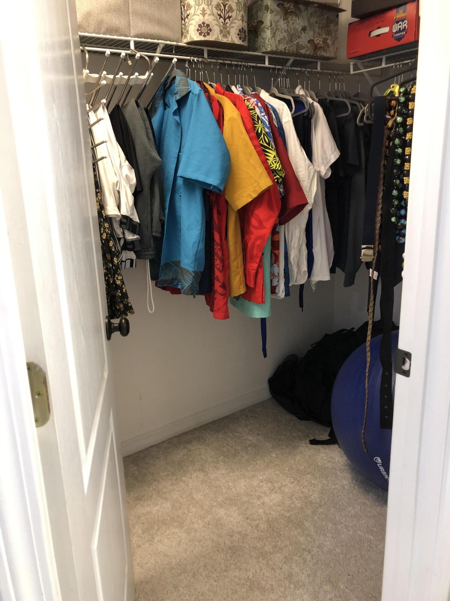 398 Riverchase Boulevard Crestview, FL 32536 - Photo 21 of 36 a view of walk in closet with clothes and shoes