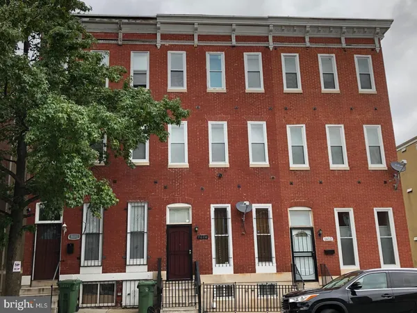 a front view of a building with a lot of windows
