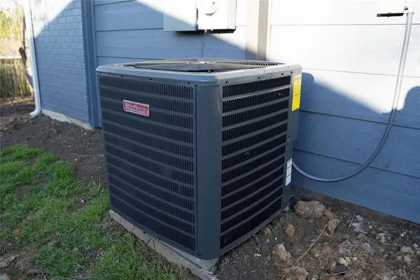 an empty room with a wooden cabinets and a window
