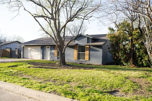 a kitchen with a sink a stove and cabinets