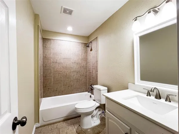 a view of room with window and ceiling fan