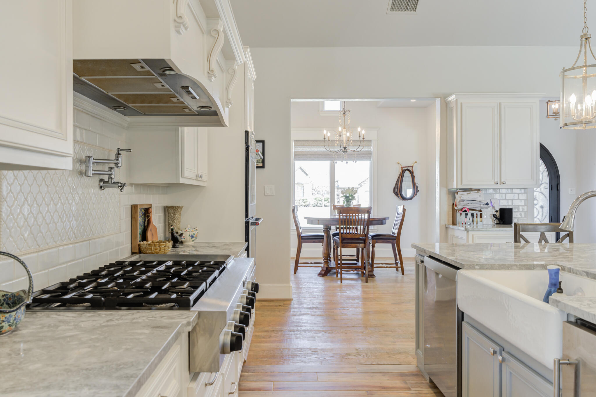 8917 County Road 6870 Lubbock, TX 79407 - Photo 12 of 53 a kitchen with stainless steel appliances a sink a stove and cabinets