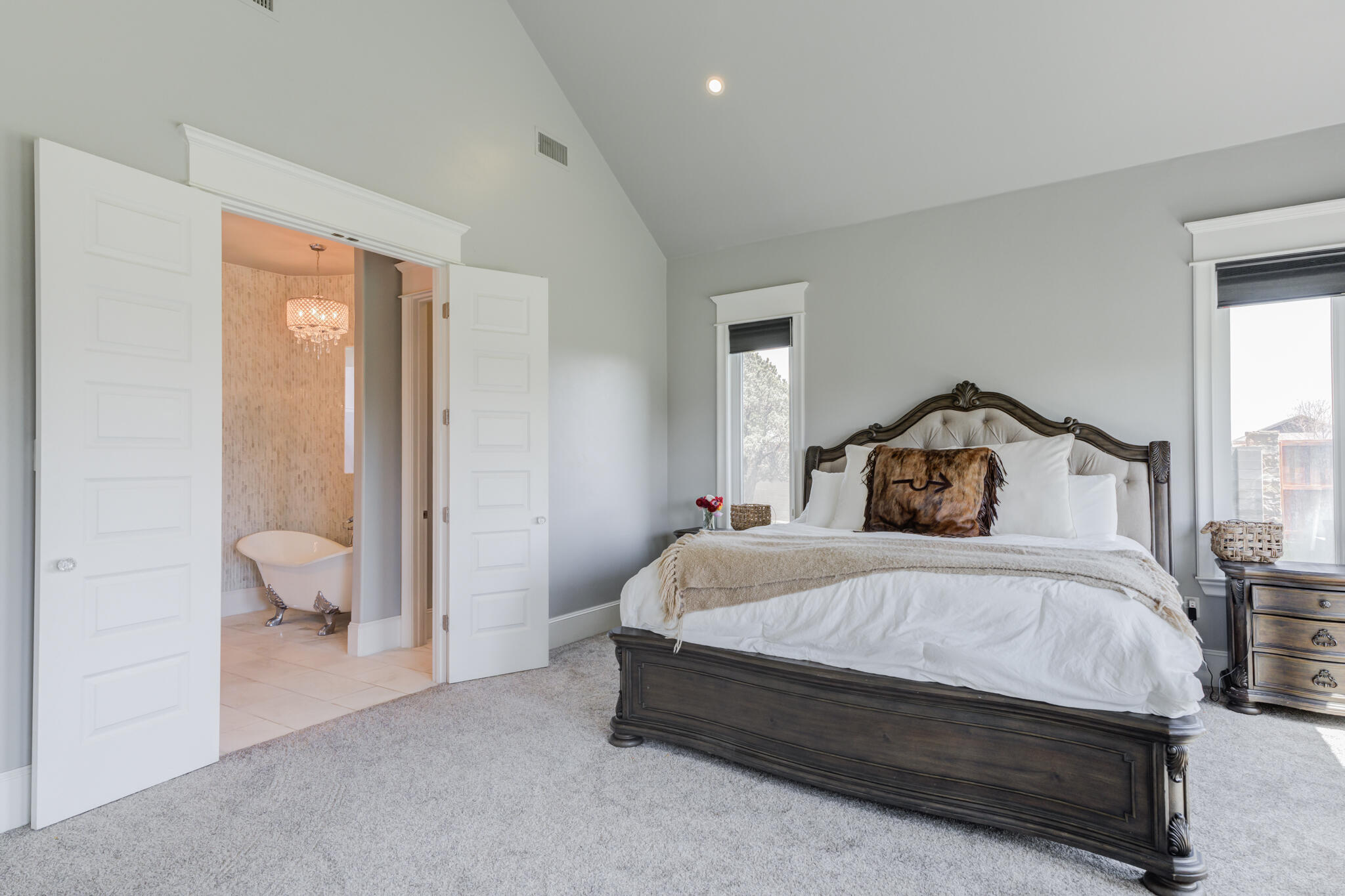 8917 County Road 6870 Lubbock, TX 79407 - Photo 20 of 53 a bedroom with a bed and a view of bathroom