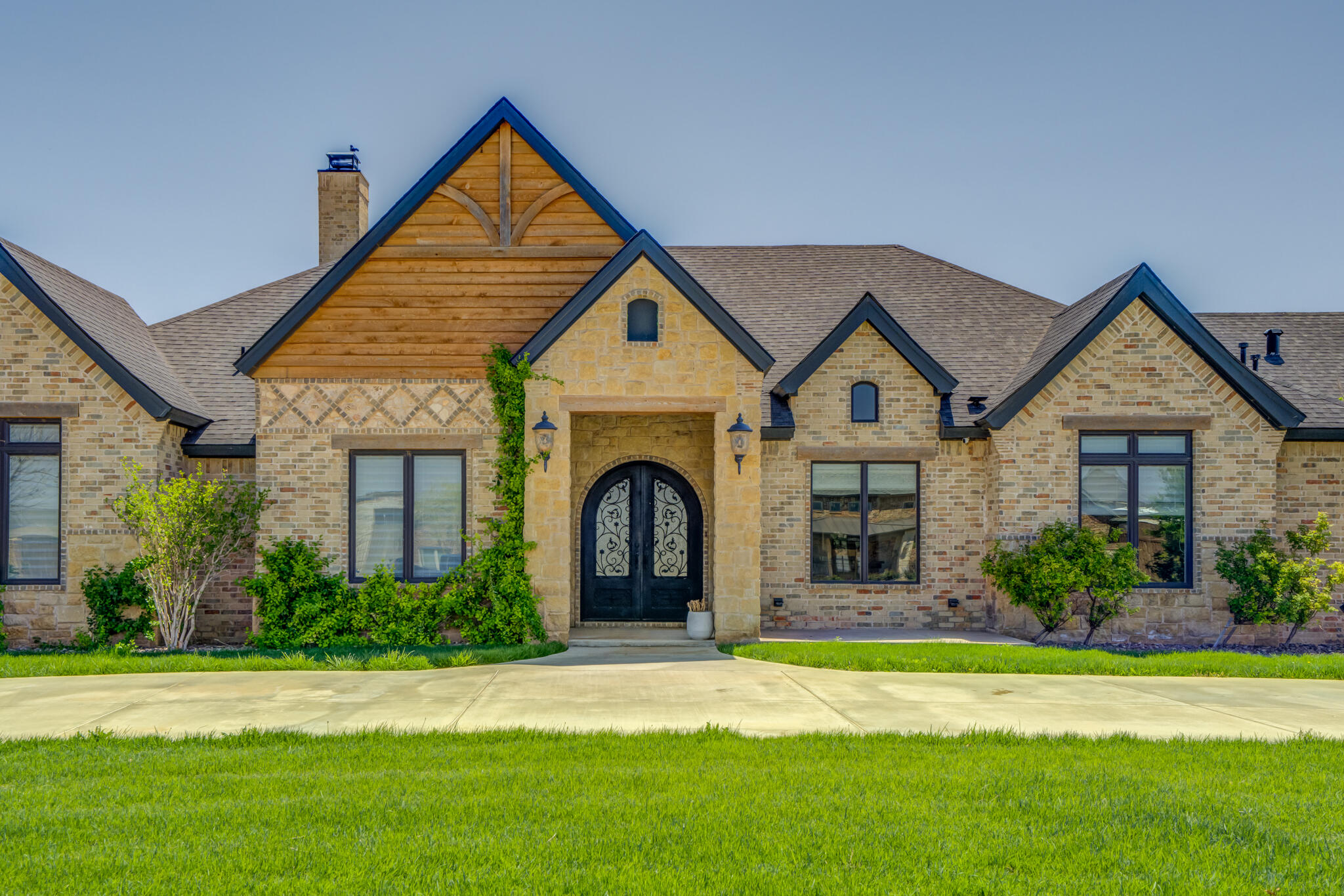 8917 County Road 6870 Lubbock, TX 79407 - Photo 2 of 53 a front view of a house with a garden and plants