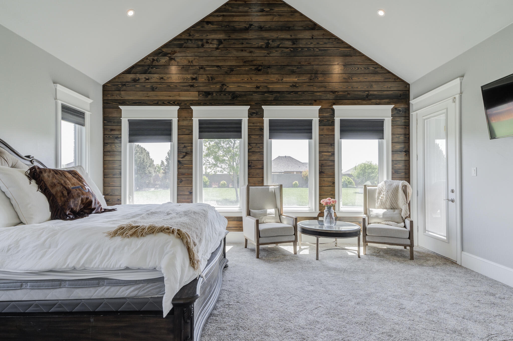 8917 County Road 6870 Lubbock, TX 79407 - Photo 21 of 53 a spacious bedroom with a bed and glass door