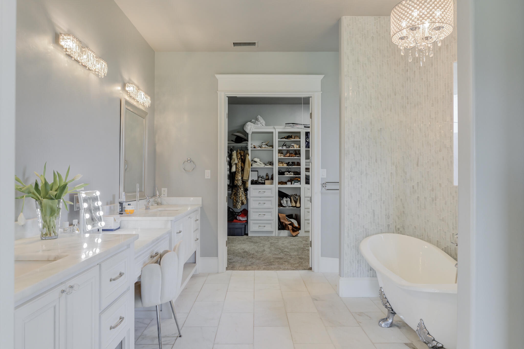 8917 County Road 6870 Lubbock, TX 79407 - Photo 22 of 53 a bathroom with a granite countertop sink a toilet and shower