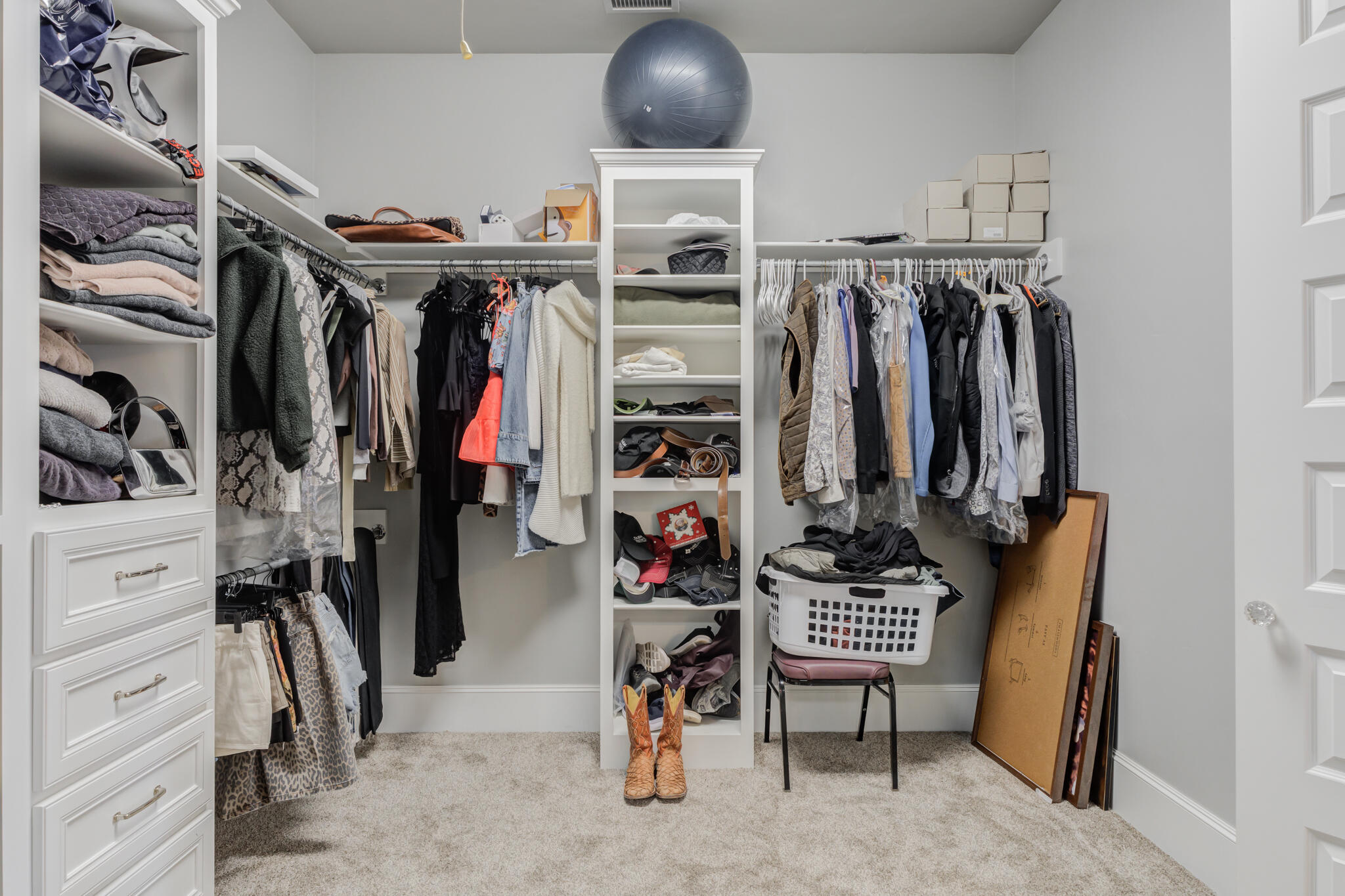 8917 County Road 6870 Lubbock, TX 79407 - Photo 28 of 53 a view of walk in closet with clothes and shoes