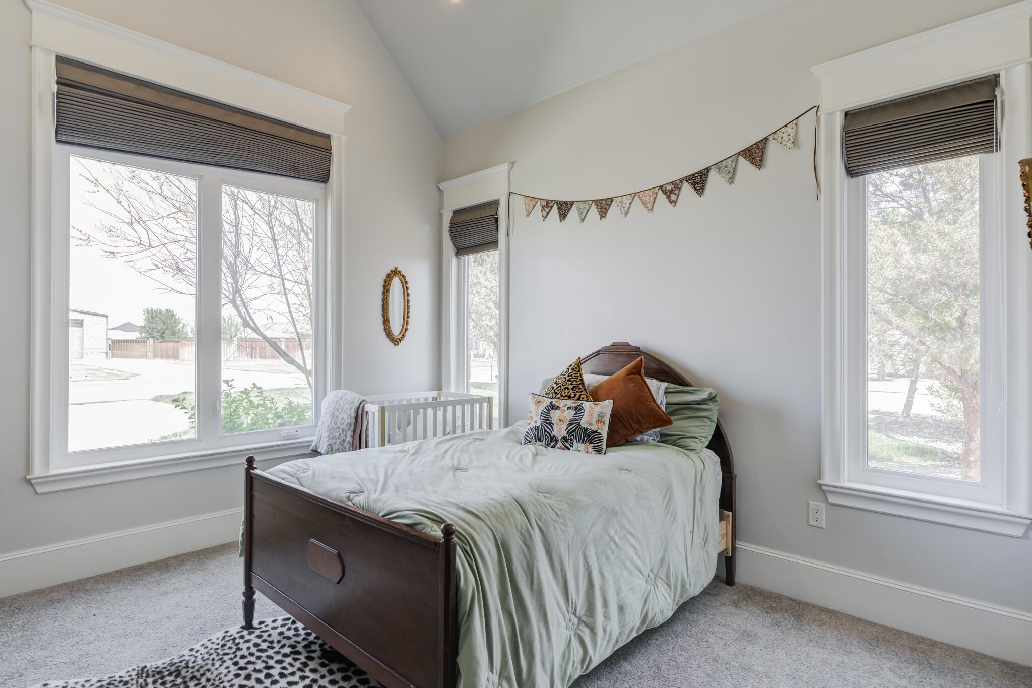 8917 County Road 6870 Lubbock, TX 79407 - Photo 29 of 53 a bed sitting in a bedroom next to a window