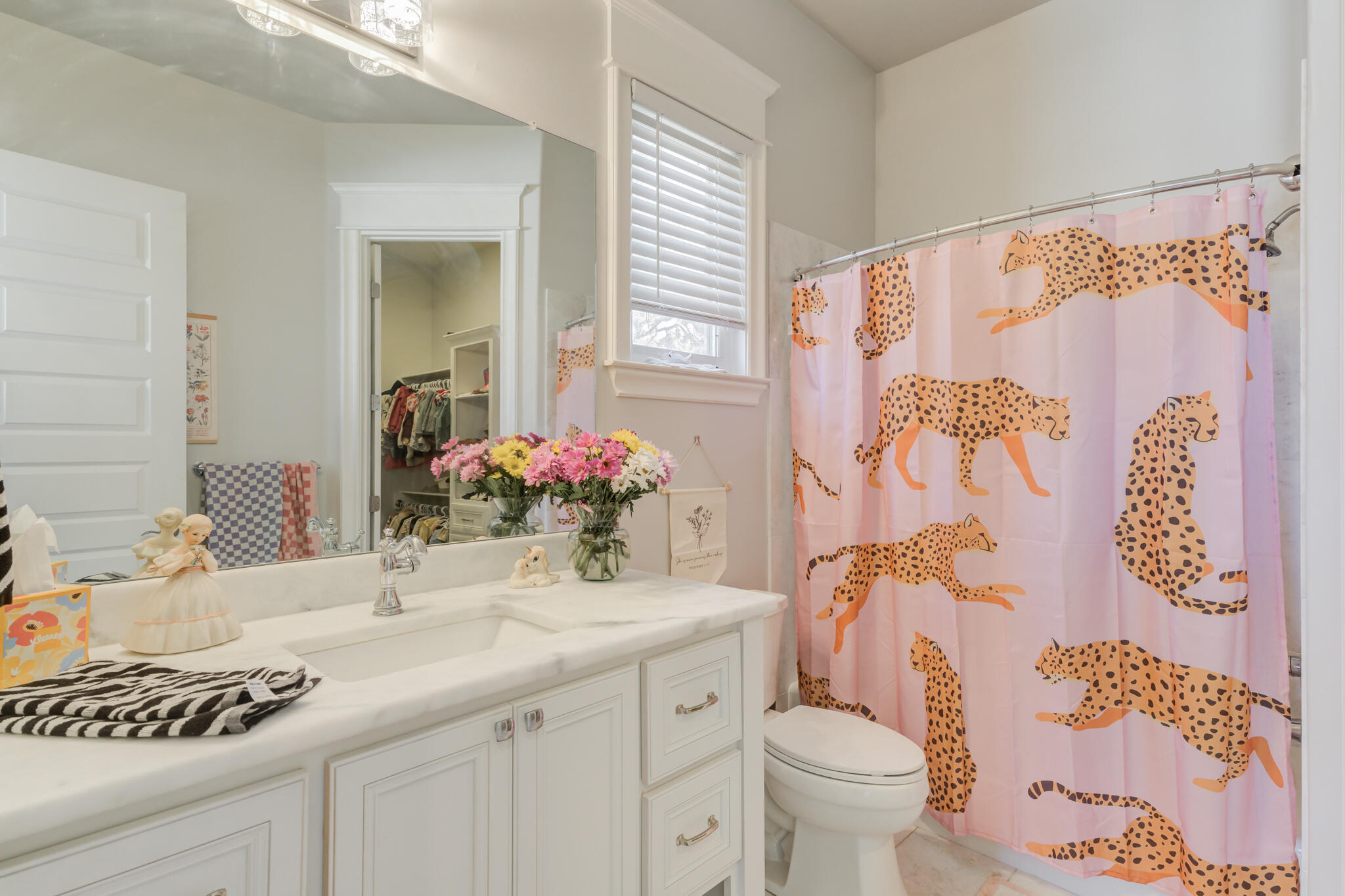 8917 County Road 6870 Lubbock, TX 79407 - Photo 31 of 53 a bathroom with a granite countertop sink a toilet and a mirror