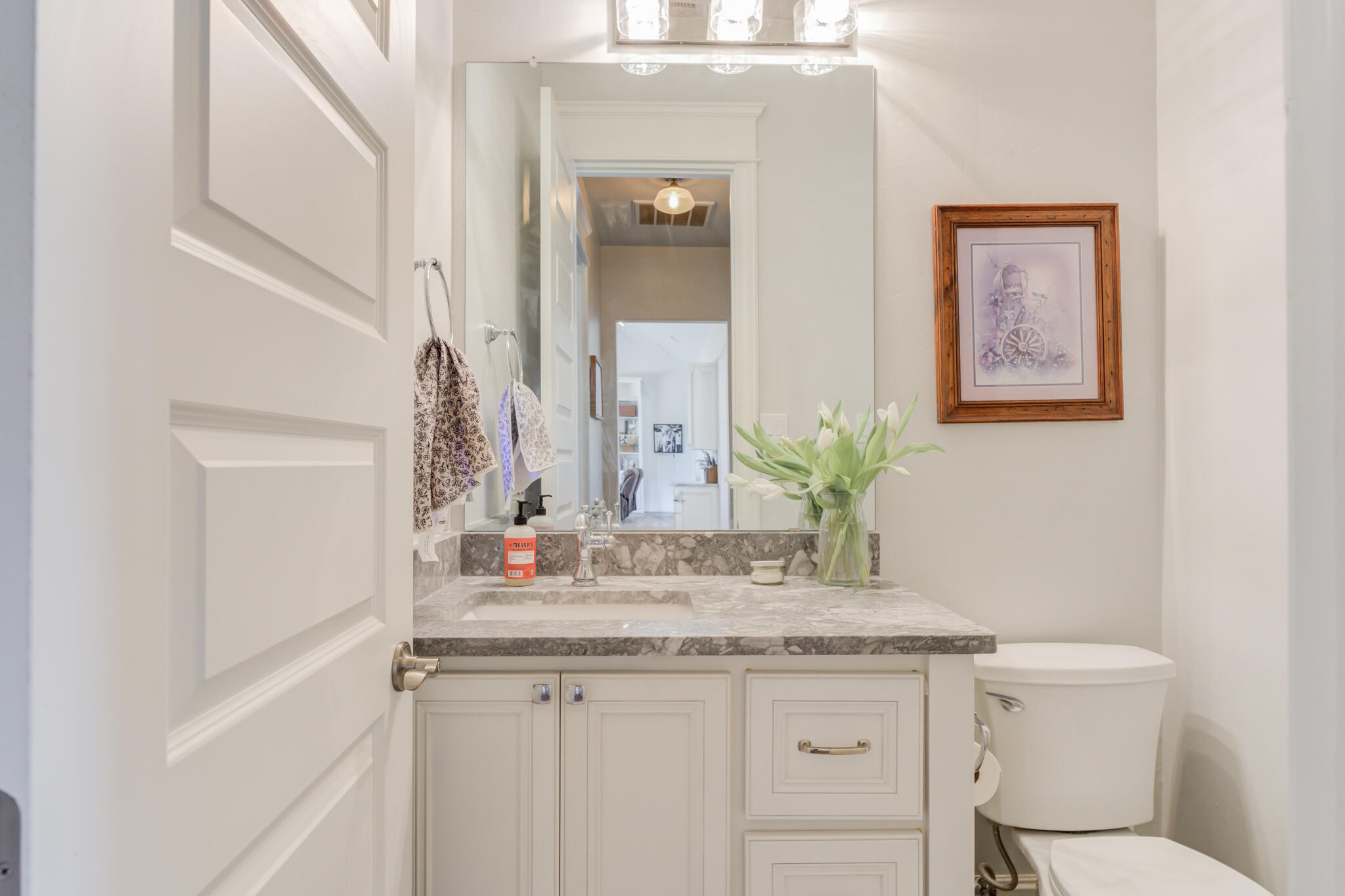 8917 County Road 6870 Lubbock, TX 79407 - Photo 36 of 53 a bathroom with a granite countertop sink and a mirror