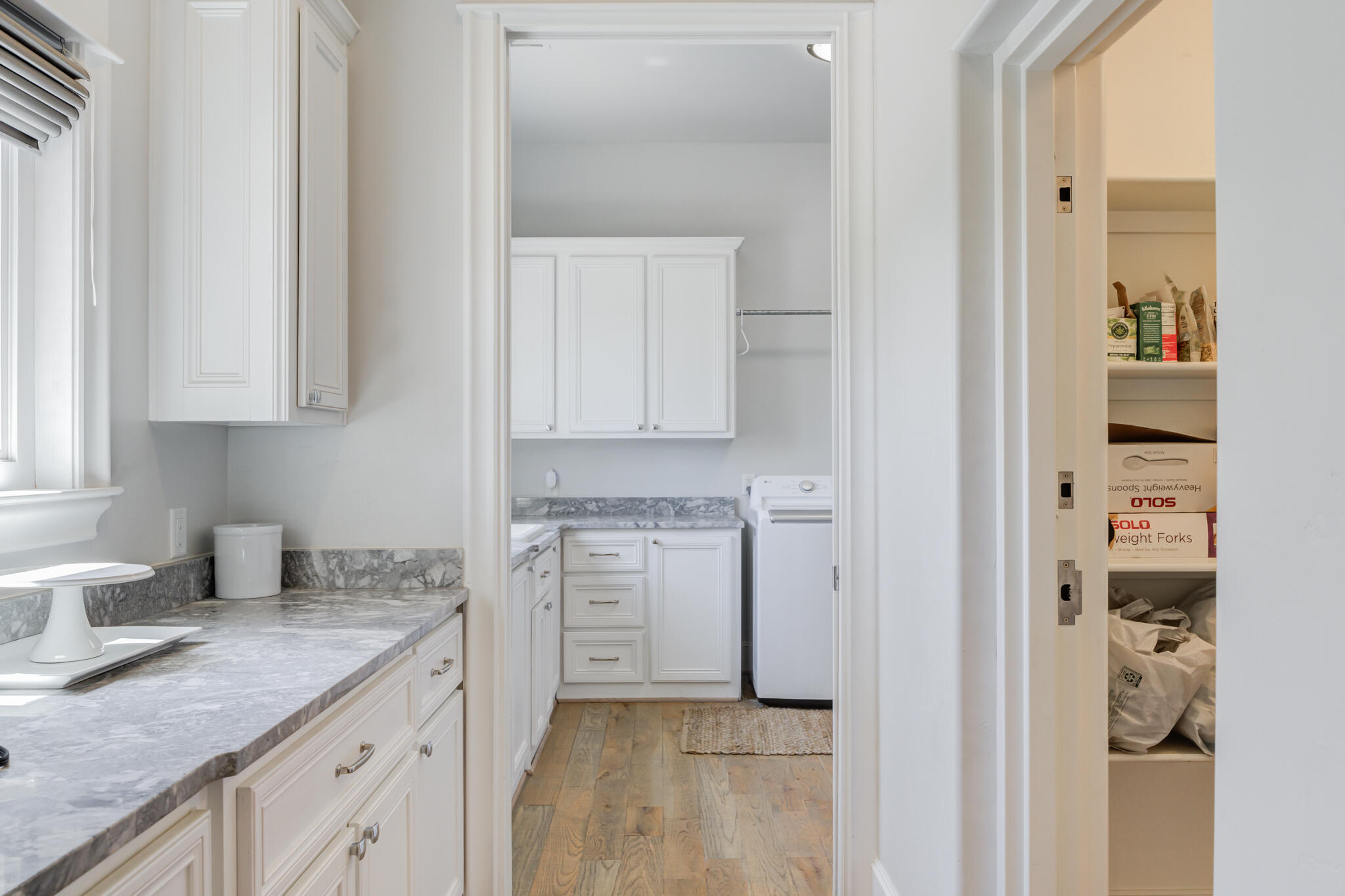 8917 County Road 6870 Lubbock, TX 79407 - Photo 37 of 53 a kitchen with white cabinets and sink