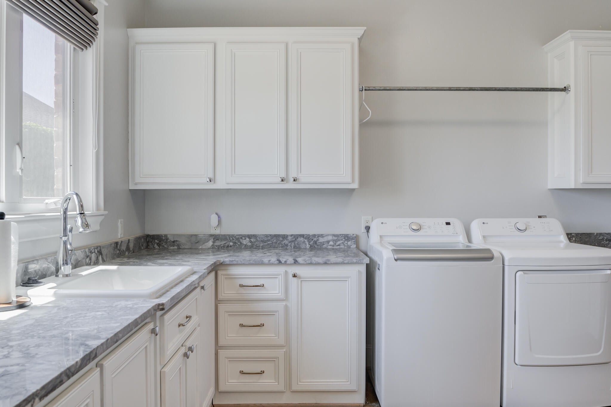 8917 County Road 6870 Lubbock, TX 79407 - Photo 38 of 53 a view of cabinets with washer and dryer