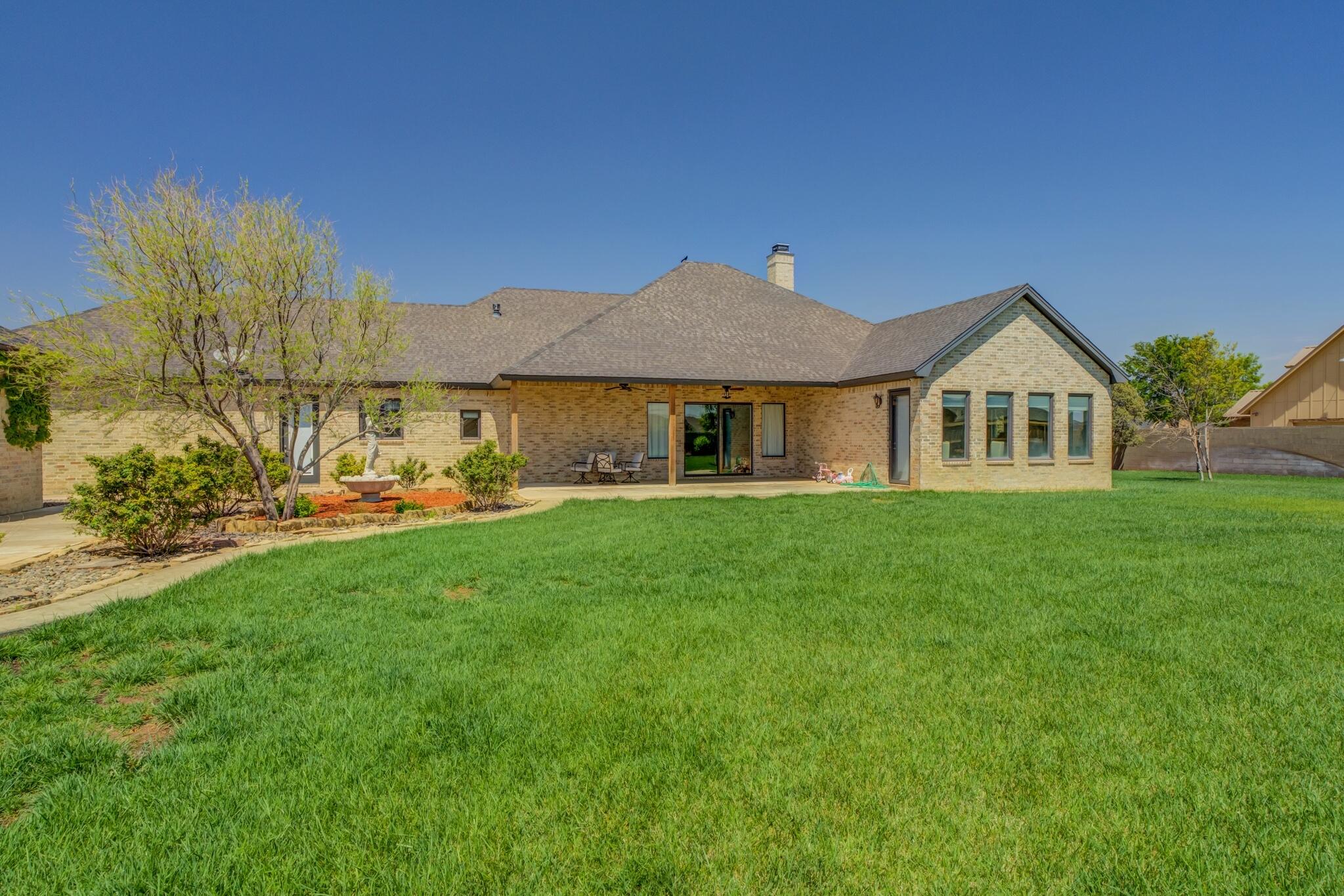 8917 County Road 6870 Lubbock, TX 79407 - Photo 40 of 53 a front view of a house with a garden