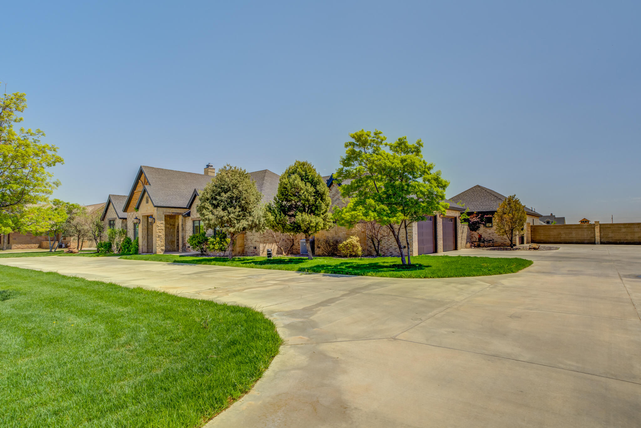 8917 County Road 6870 Lubbock, TX 79407 - Photo 4 of 53 a front view of a house with a yard and trees