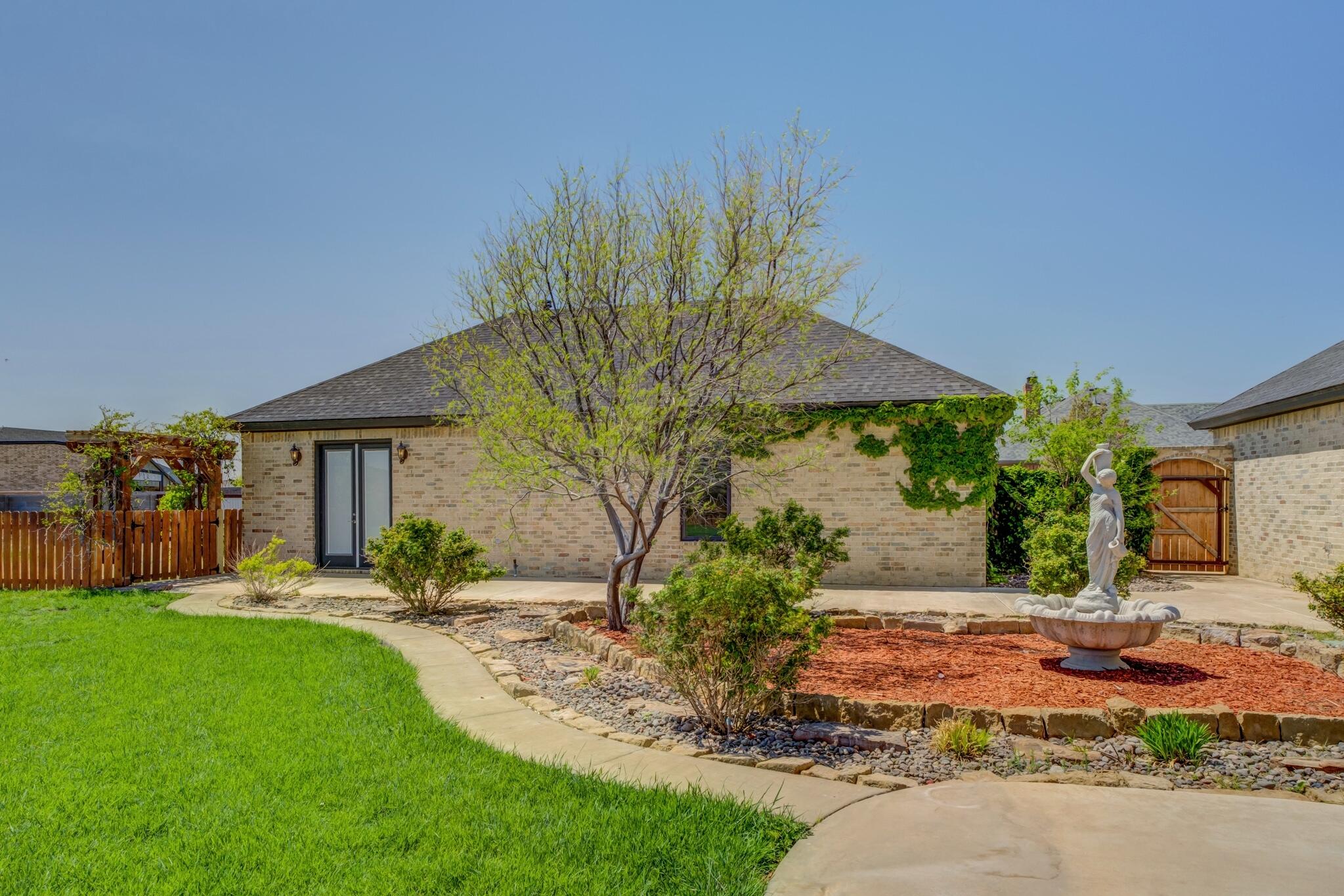 8917 County Road 6870 Lubbock, TX 79407 - Photo 44 of 53 a front view of a house with garden